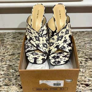 Black and white All Black slides. The perfect height and pattern! Like new.